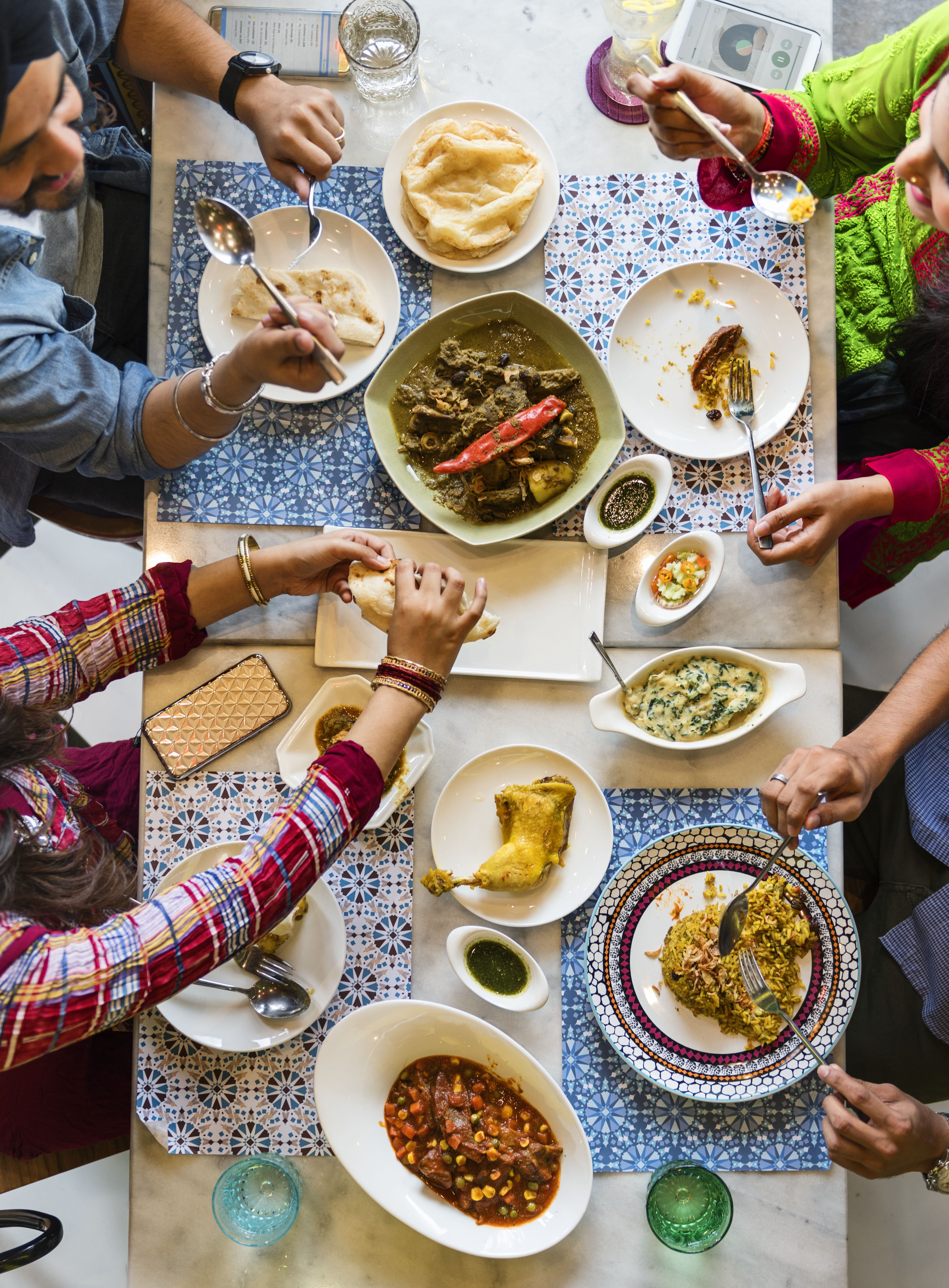 A group of Indian people is having lunch together